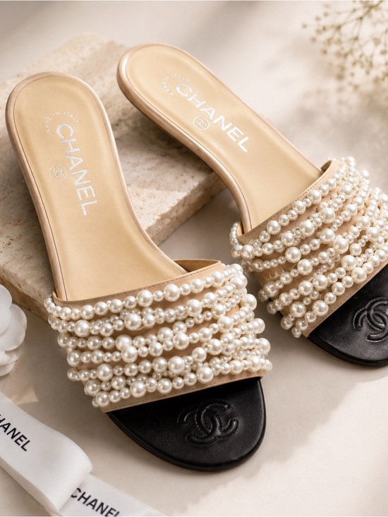 CHANEL Shoes - CHANEL Pearl-Strap Beige and Black Slide Mules
